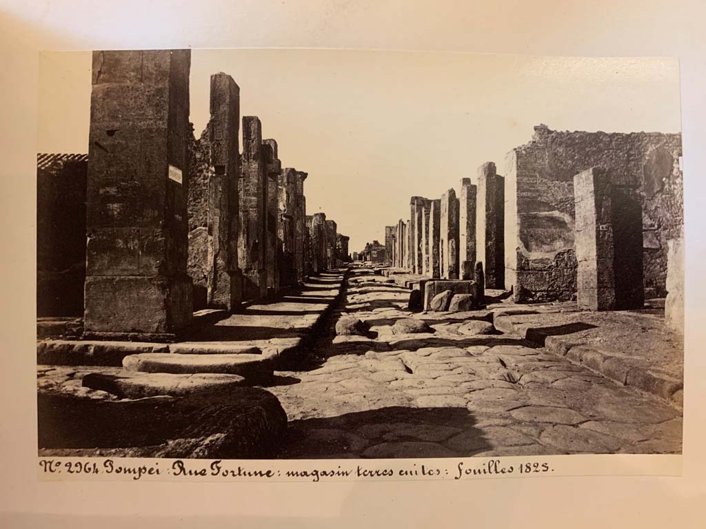 Fountain outside VI.13.7.  Via della Fortuna between VII.4 and VI.13, looking west. 
From an album of Michele Amodio dated 1874, entitled Pompei, destroyed on 23 November 79, discovered in 1745. 
Photo courtesy of Rick Bauer.
