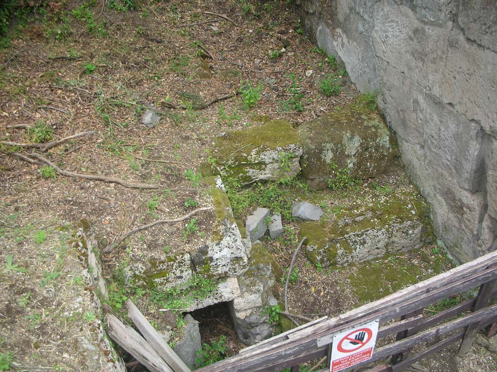 Nola Gate, Pompeii. May 2010. 
Entry to drain at east end of Via di Nola, and steps on north side of Nola Gate. Photo courtesy of Ivo van der Graaff.
