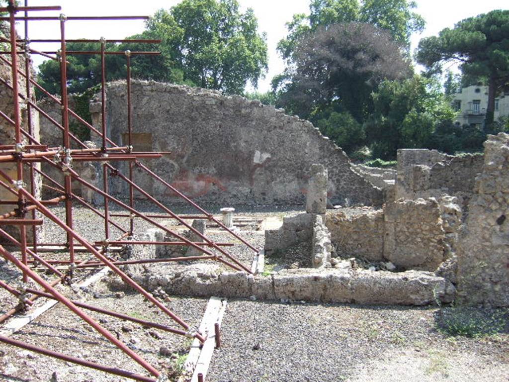 I.2.13 Pompeii. September 2005.  The area at the front, right, of the picture corresponds to the rear room of both I.2.12 and I.2.13.

