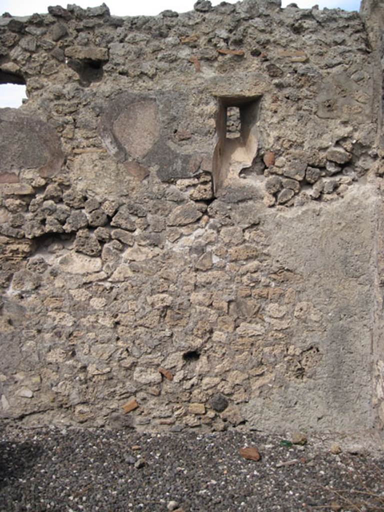 I.3.12 Pompeii. September 2010. North wall in rear room in north-east corner with slit window onto Vicolo del Menandro. Photo courtesy of Drew Baker. According to CTP, when the survey was written  the north wall of the back room has now vanished.
See Van der Poel, H. B., 1986. Corpus Topographicum Pompeianum, Part IIIA. Austin: University of Texas. (p.6)

