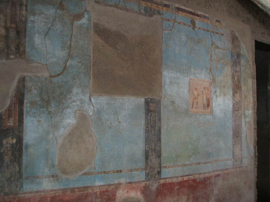 I.6.11 Pompeii. December 2004. East wall in atrium with wall painting.