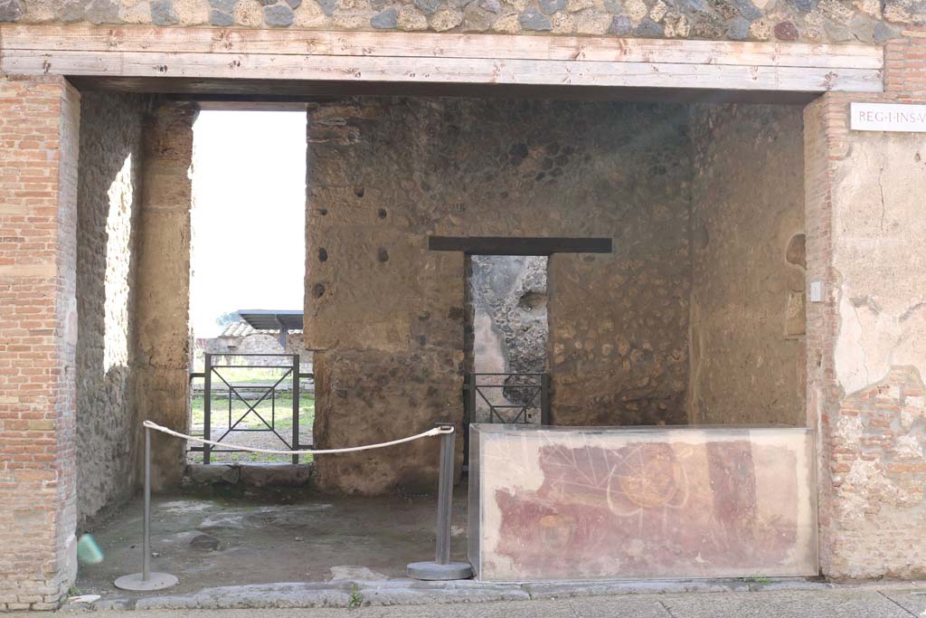 I.8.1 Pompeii. December 2018. 
Looking across entrance doorway towards south wall with two doorways in I.8.2. Photo courtesy of Aude Durand.
