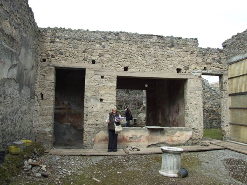 I.9.14 Pompeii. March 2009. Room 8, atrium looking north. The doorway to room 9 is on left, tablinum room 6 with window is centre and corridor to rear is on right.
