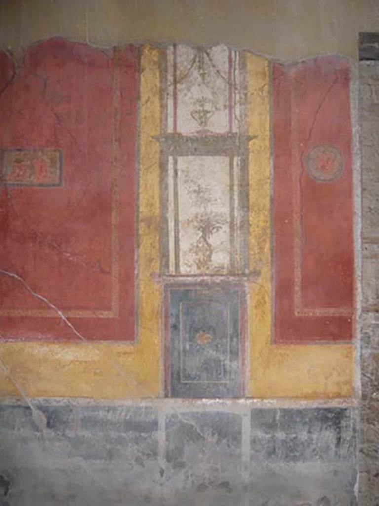 I.10.4 Pompeii. May 2012. Detail of west wall on south side of room 7, in south-west corner of atrium. Photo courtesy of Buzz Ferebee.
