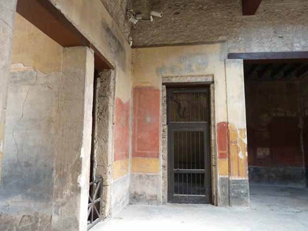 I.10.4 Pompeii. May 2010.  North-east corner of atrium and east wall, including east wall of entrance corridor, and doorways to rooms 1,3 and 4.
