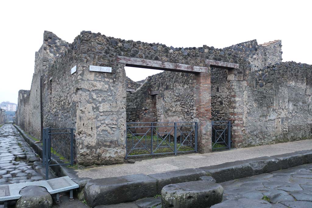 I.13.5 Pompeii, with I.13.4, centre right. December 2018, 
Entrance doorways on south side of Via dellAbbondanza, at junction with Via di Nocera. Photo courtesy of Aude Durand.

