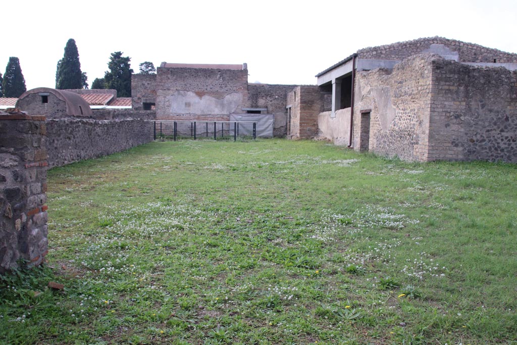 II.4.6 Pompeii. October 2022. 
Looking west across garden area towards swimming pool, with 11.4.7, on right. Photo courtesy of Klaus Heese.
