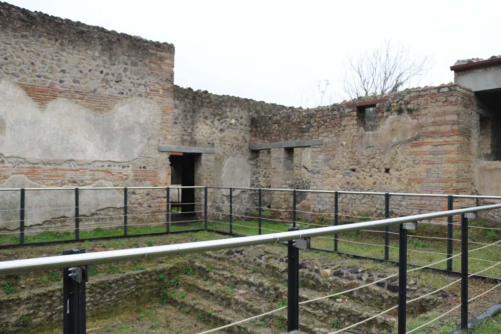 II.4.6 Pompeii. December 2018. Looking north-west across swimming pool, with 11.4.7. Photo courtesy of Aude Durand.