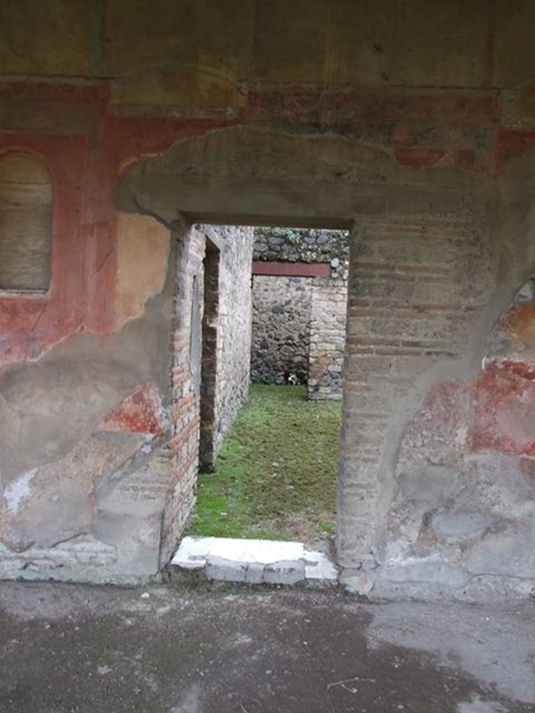 II.4.6 Pompeii. December 2006.  Doorway to room with two doorways to a corridor in its west wall. In the south wall, on the left, is a doorway leading into the room on the north side of summer triclinium. 

