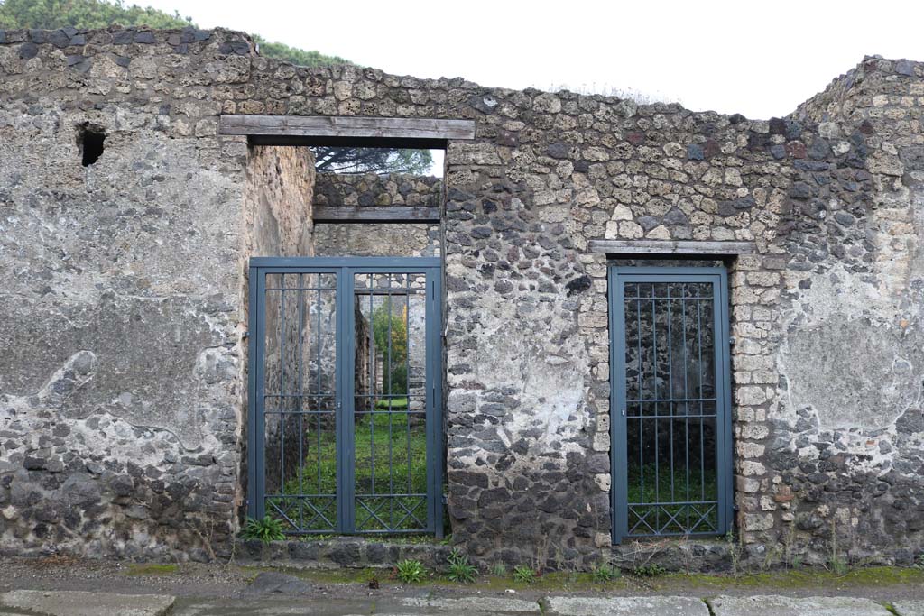 II.8.4 Pompeii, on right. December 2018. 
Looking east on Via di Nocera towards entrance doorways, with II.8.5, on left. Photo courtesy of Aude Durand.
