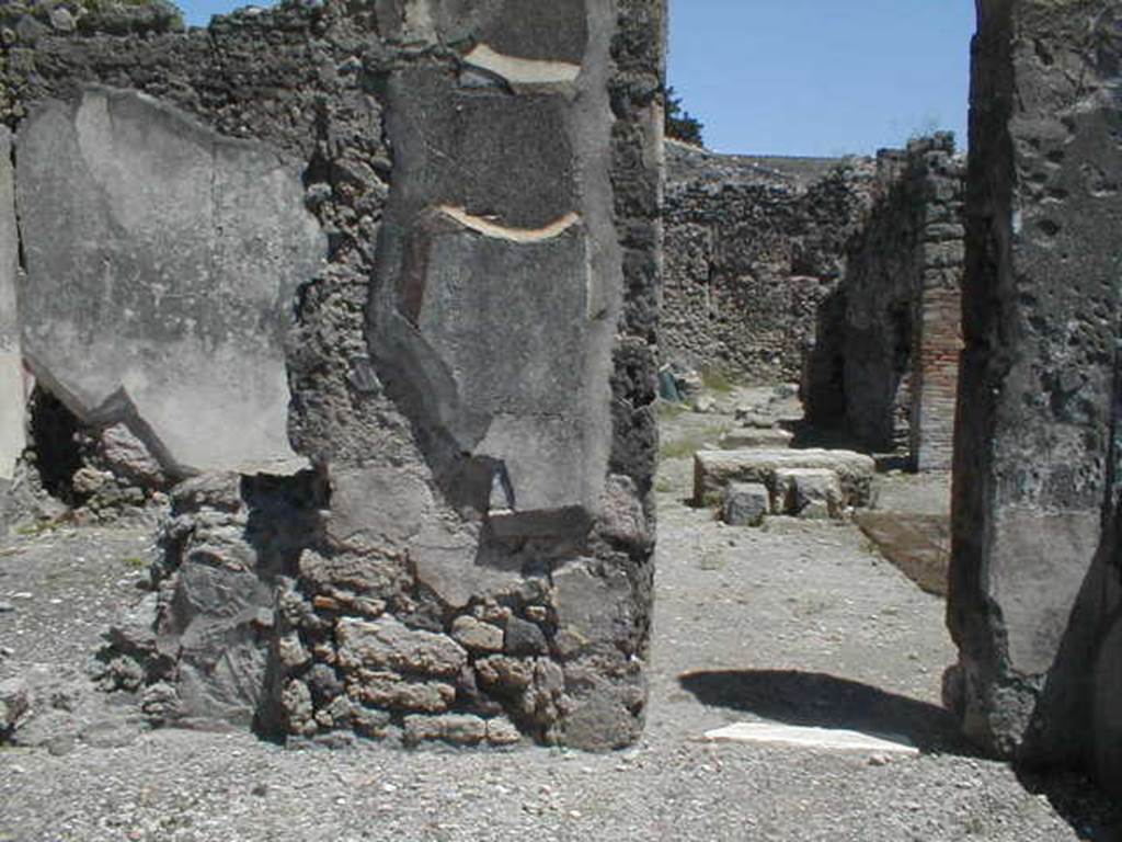 V.I.14 Pompeii.  May 2005.  Doorway in south east corner leading to atrium of V.1.15