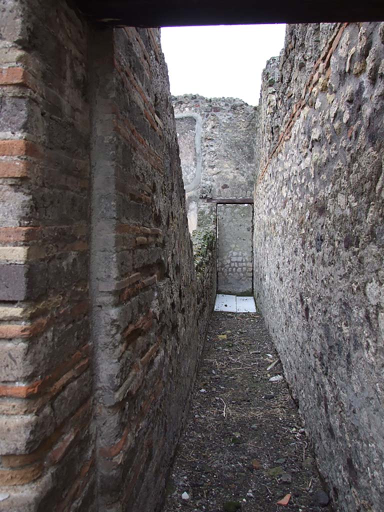 VI.7.18 Pompeii. December 2006. Corridor to blocked doorway into VI.7.1, on west side of triclinium.