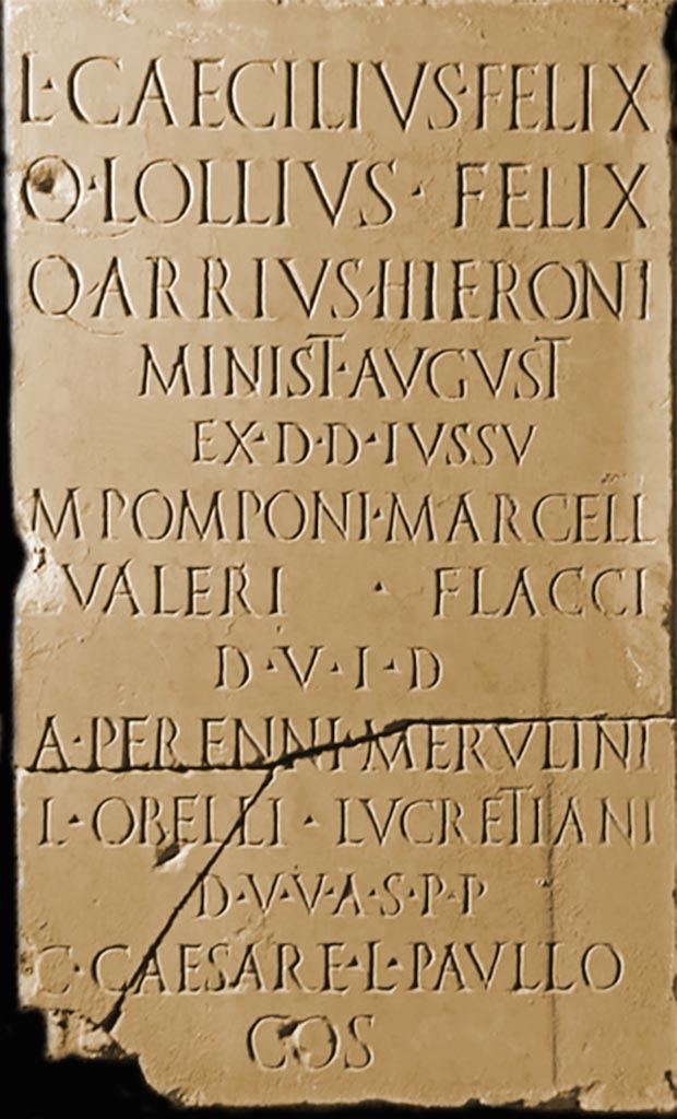 VI.8.5 Pompeii. June 2017. 
Slab of marble with inscription, from around 1AD, found in vicinity of Tablinum/Peristyle, 2nd March 1825.
Now in Naples Archaeological Museum, inv. no. 3779.
Detail from photo courtesy of Giuseppe Ciaramella.

According to the Epigraphic Database Roma this reads
L(ucius) Caecilius Felix,
Q(uintus) Lollius Felix,
Q(uintus) Arrius Hieroni,
minist(ri) August(i),
ex d(ecreto) d(ecurionum), iussu 
M(arci) Pomponi Marcell(i),
Ḷ(uci) Valeri Flacci
d(uum)v(irorum) i(ure) d(icundo),
A(uli) Perenni Merulini,
L(uci) Obelli Lucretiani 
d(uum)v(irorum) v(iis) a(edibus) s(acris) p(ublicis) p(rocurandis),
C(aio) Caesare, L(ucio) Paullo
co(n)s(ulibus)      [CIL X 891]

According to the information card in the Museum –
Action taken by the Ministers of Augustus by decree of the decurions and by order of the duoviri and the aediles
“Lucius Caecilius Felix, Quintus Lollia Felix, Quintus Arrius Hieroni, ministers of Augustus by decree of the decurions and by order of the duoviri Marcus Pomponius Marcellus and Lucius Valerius Flaccus, duoviri with judicial powers, Lucius Obellius Lucretianus and Aulus Perennius Merulinus duoviri v.a.s.p.p. during the consulate of Gaius Caesar and Lucius Paullus”.
The inscription is dated to 1AD by its mention of the consuls in office in Rome. 
The magistri of the aediles is indicated by the peculiar formula d(uoviri) v(iis) a(edficiis) s(acris) p(ublicis) p(rocurandis).
See Fiorelli G., 1864. Pompeianarum antiquitatum historia, Vol. 3: Naples, Addenda, p.59.
