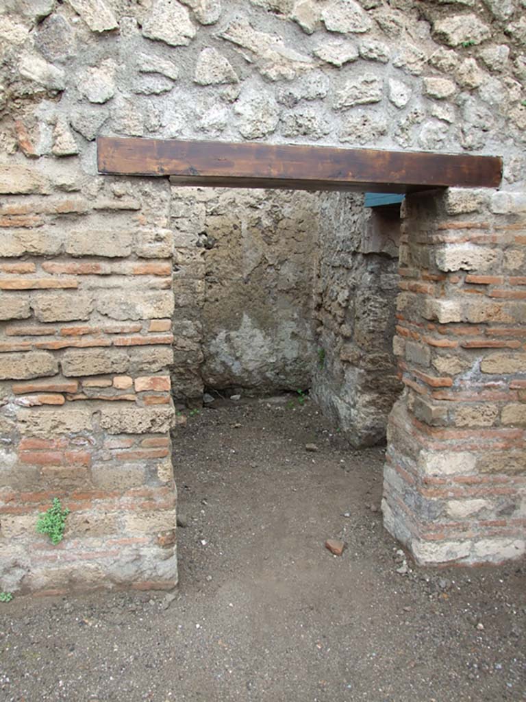 VI.8.9 Pompeii. May 2010. Doorway in north wall of rear room, with another room on its east side.