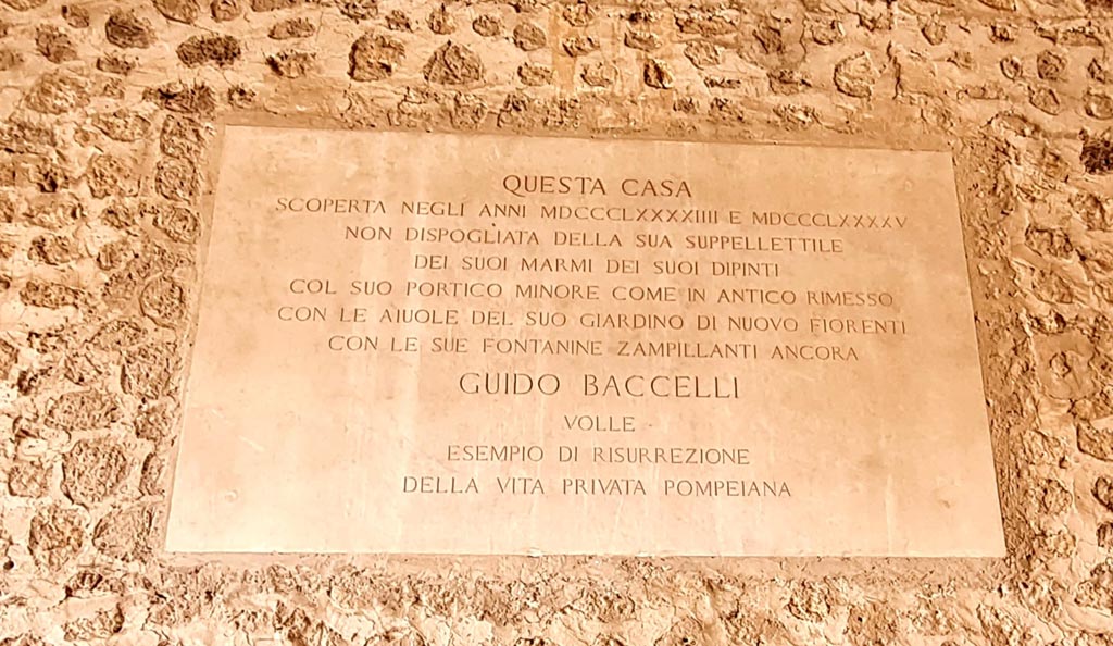 VI.15.1 Pompeii. April 2023. Wall plaque on west wall. Photo courtesy of Giuseppe Ciaramella.