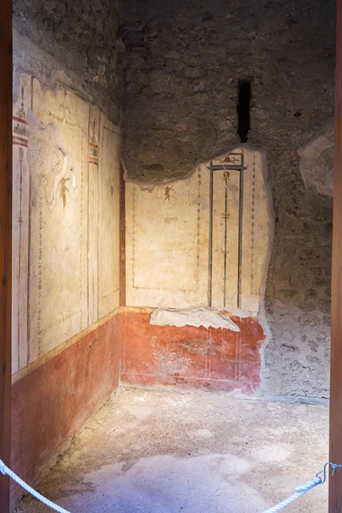 VI.15.1 Pompeii. March 2023. 
Looking south through doorway into cubiculum/bedroom (f). Photo courtesy of Johannes Eber.
