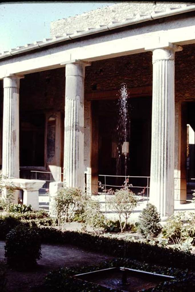 VI.15.1  Pompeii, 1968. Looking east across peristyle with fountain across portico towards doorway to atrium. Photo by Stanley A. Jashemski.
Source: The Wilhelmina and Stanley A. Jashemski archive in the University of Maryland Library, Special Collections (See collection page) and made available under the Creative Commons Attribution-Non Commercial License v.4. See Licence and use details.
J68f0095
