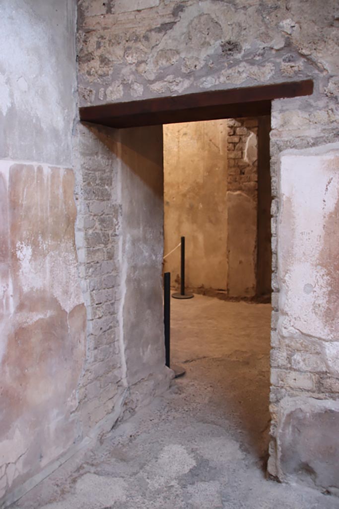 VI.15.1 Pompeii. October 2023. 
Doorway to kitchen (w) in north-west corner of small atrium. Photo courtesy of Klaus Heese.
