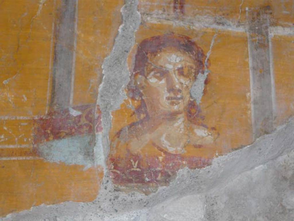 VI.16.7 Pompeii. June 2013. Room N, painting of face on west end of north wall, after restoration.
Photo courtesy of Buzz Ferebee.

