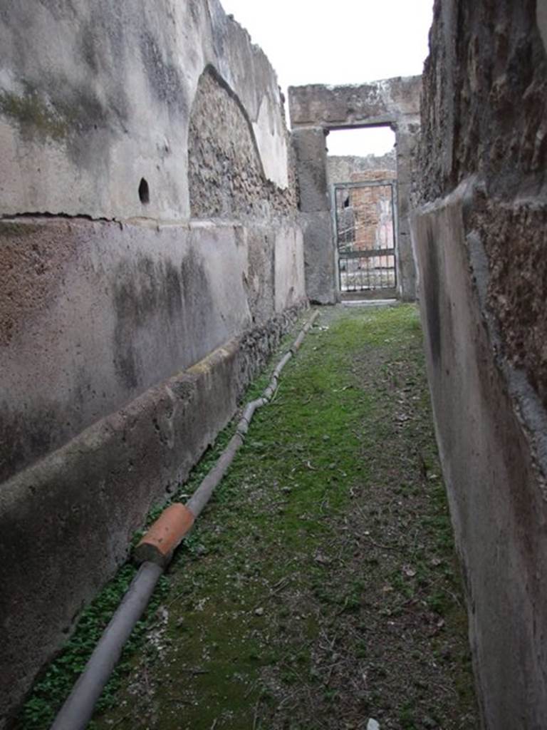 VII.1.8 Pompeii. December 2007. Womens changing room 11. Looking east along corridor 12 to entrance at VII.1.17.
