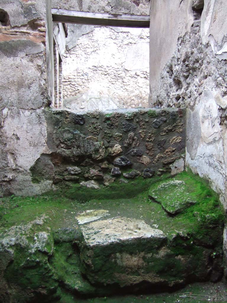 VII.11.12 Pompeii. December 2005. Cella meretricia with stone bed, under steps to upper floor.