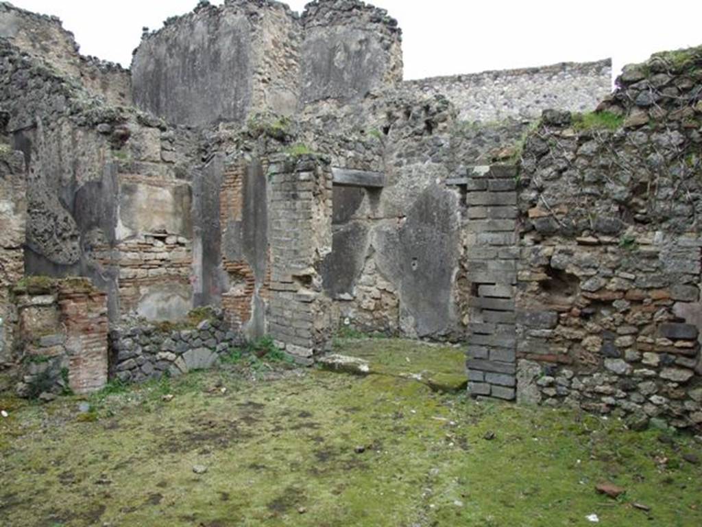 VII.11.14 Pompeii.  March 2009. North east corner of Garden area A, with step to entrance passageway, Room 1.