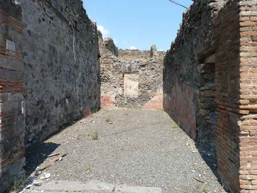 VII.12.27 Pompeii. May 2010. Looking north from Vicolo del Balcone Pensile.