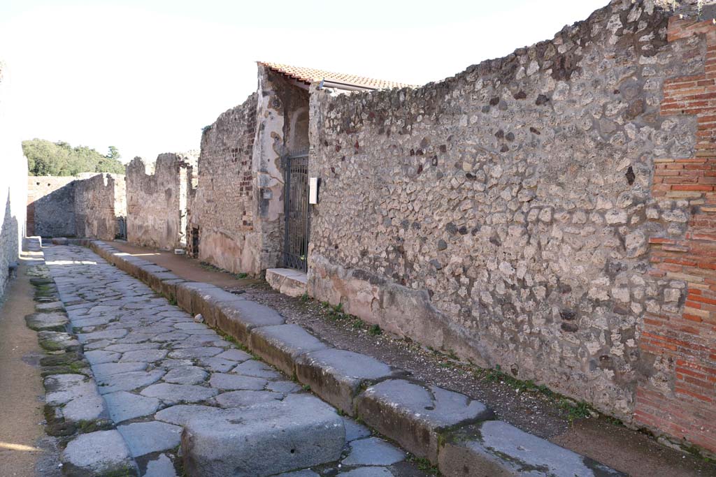 VIII.2.26 Pompeii. December 2018. 
Looking east along south side of Via della Regina towards entrance doorway of VIII.2.26, centre left. Photo courtesy of Aude Durand.
