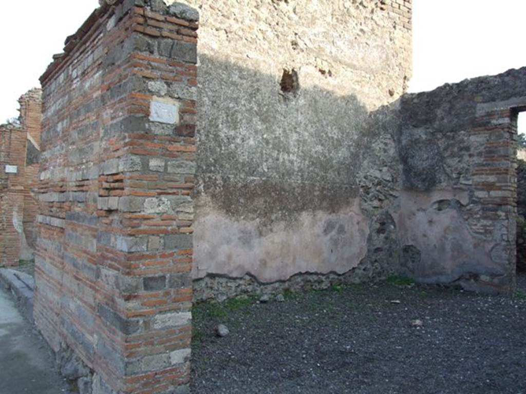 VIII.4.7 Pompeii. December 2007. Entrance and east wall of shop. 
Also showing the pilaster on the left of the doorway, between VIII.4.8 and 7. Painted in red and black, and found in May 1855, on this pilaster were:

Lollium  Fuscum
aed(ilem)  o(ro)  v(os)  f(aciatis)    [CIL IV 734]

N(umerium)  Popidium  Rufum
II vir(um)  Severus  rog(at)     [CIL IV 735]

Postumium
quinq(uennalem)    [CIL IV 736]

L(ucium)  Ceium  Secum  II vir(um)  o(ro)  v(os)  f(aciatis)
Amiullius  Cosmus  cum
()ario  rog(at)     [CIL IV 737]

[E]pidium  Sabinum
II vir(um)  Po[st]umi  faciunt    [CIL IV 738]

Lollium
aed(ilem)  o(ro)  v(os)  f (aciatis)    [CIL IV 771]

See Pagano, M. and Prisciandaro, R., 2006. Studio sulle provenienze degli oggetti rinvenuti negli scavi borbonici del regno di Napoli.  Naples : Nicola Longobardi.  (p. 172)
According to Della Corte, the two shops at VIII.4.8 and VIII.4.7 were under the ownership of one (Ianu)arius and another called Severus. He reached this conclusion because the two electoral recommendations were written one near the other on the dividing pilaster of the two shops:
Severus  rog(at)    [CIL IV 735]
and
[CIL IV 737] above, where he interpreted ()ario as (Ianu)ario.
See Della Corte, M., 1965.  Case ed Abitanti di Pompei. Napoli: Fausto Fiorentino. (p. 236)

