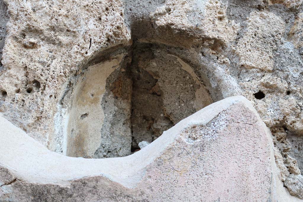 Vicolo di Tesmo, east side, Pompeii. December 2018.
Detail of niche behind plaster on exterior wall of IX.7.20. Photo courtesy of Aude Durand.
