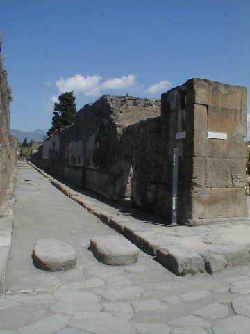 Vicolo del Fauno. May 2010. Looking south between VI.12 and VI.10. from near VI.10.16.