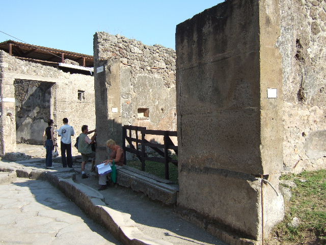 Vicolo del Lupanare, May 2010. Looking south between VII.1.and VII.12, from Via degli Augustali.