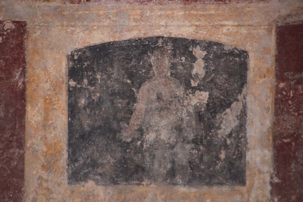 Stabiae, Villa Arianna, October 2020. Room 3, painted figure from zoccolo under mask panel at west end of south wall. Photo courtesy of Klaus Heese.