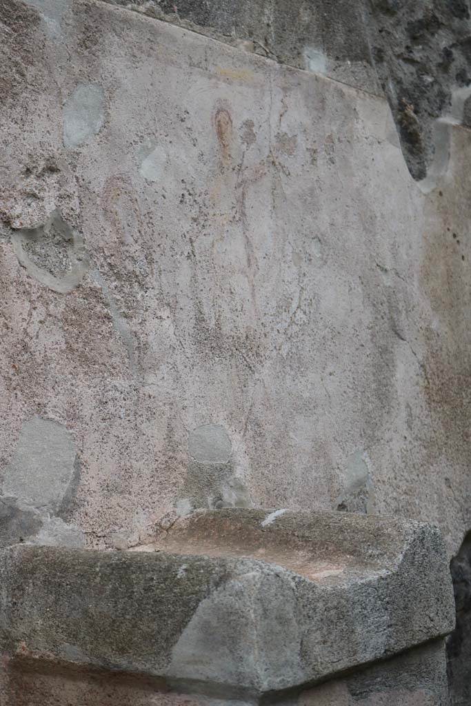 Street altar on west side wall of I.11.1. December 2018. 
Detail of top of altar with remains of painting of street shrine, above. Photo courtesy of Aude Durand.