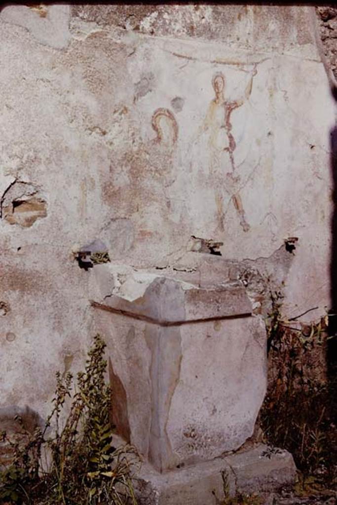 Pompeii, street altar on west side wall of I.11.1, 1966.   Photo by Stanley A. Jashemski.
Source: The Wilhelmina and Stanley A. Jashemski archive in the University of Maryland Library, Special Collections (See collection page) and made available under the Creative Commons Attribution-Non Commercial License v.4. See Licence and use details.
J66f0404