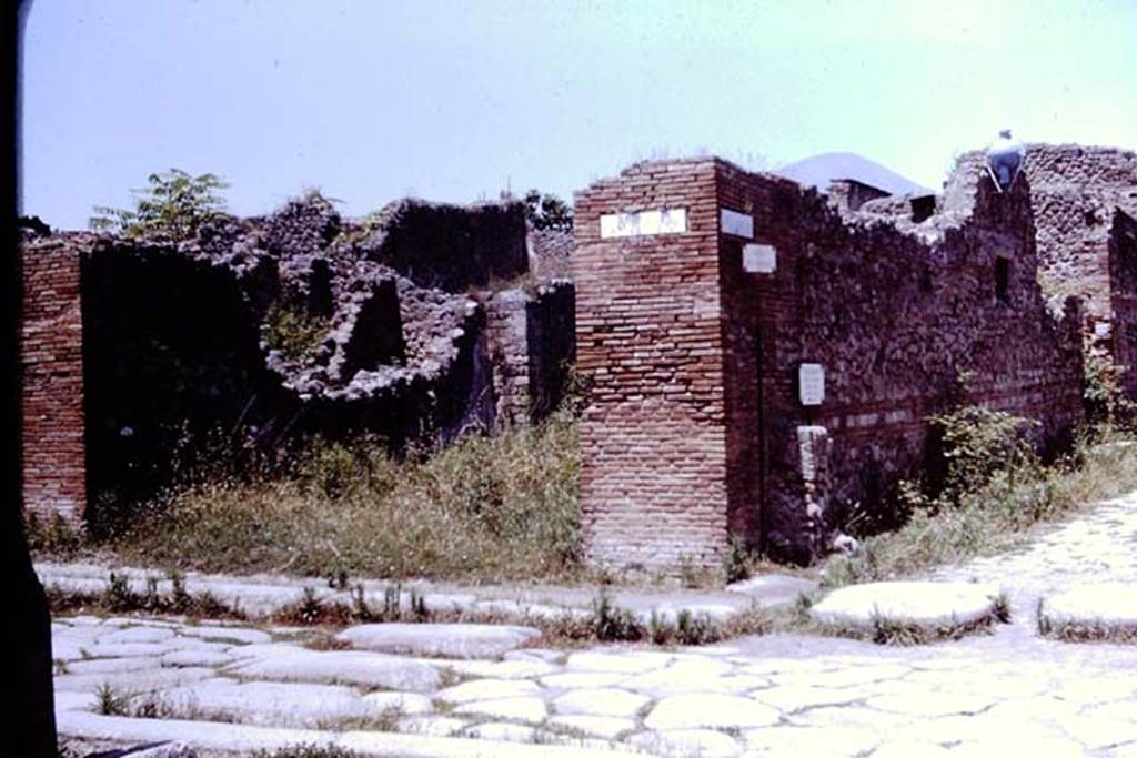 VII.14.14 Pompeii. 1964. Street altar on side wall at corner of  Vicolo del Lupanare. Photo by Stanley A. Jashemski.
Source: The Wilhelmina and Stanley A. Jashemski archive in the University of Maryland Library, Special Collections (See collection page) and made available under the Creative Commons Attribution-Non Commercial License v.4. See Licence and use details.
J64f1064