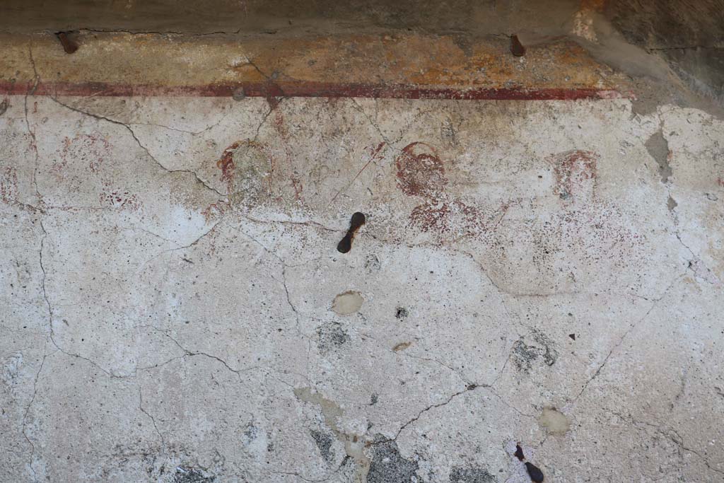 Painted street shrine to twelve gods on corner of insula at VIII.3.11 in December 2018. 
Detail from north end of centre. Photo courtesy of Aude Durand.