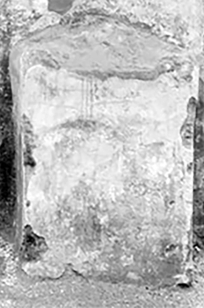 Street shrine outside IX.12.7. Detail from 1912 photograph. 
According to Fröhlich, on the south side to the left was a pig's head in profile and to the right was an older, translucent pigs head.
The altar was decorated with sausages and pigs’ heads.
See Fröhlich, T., 1991. Lararien und Fassadenbilder in den Vesuvstädten. Mainz: von Zabern. (p. 339, F71, T: 58,2).