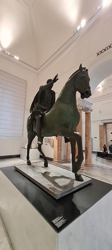 Arch of Caligula, Pompeii. April 2023. 
Equestrian statue found in pieces beneath the arch and rebuilt.
On display in “Campania Romana” gallery in Naples Archaeological Museum
Photo courtesy of Giuseppe Ciaramella.
