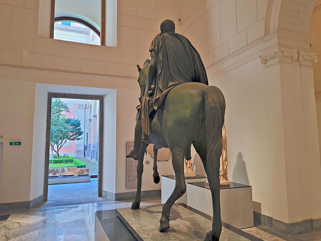 Arch of Caligula, Pompeii. April 2023. Rear of equestrian statue found in pieces beneath the arch and rebuilt. 
On display in “Campania Romana” gallery in Naples Archaeological Museum. Photo courtesy of Giuseppe Ciaramella.