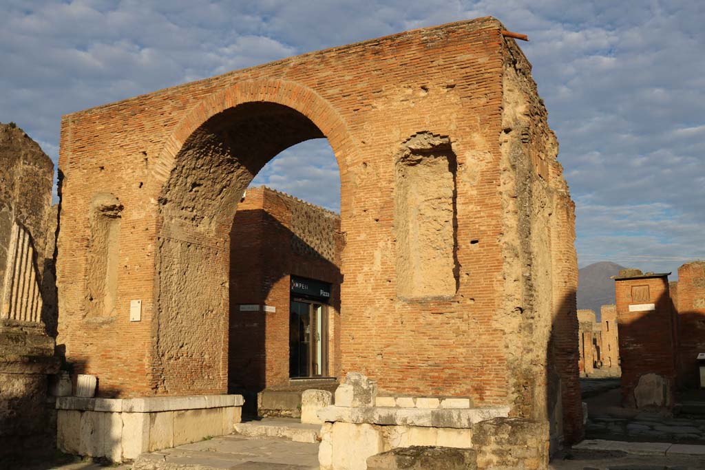 Arch at north-east end of the Forum. December 2018. 
Looking north-west through arch towards the modern restaurant. Photo courtesy of Aude Durand.