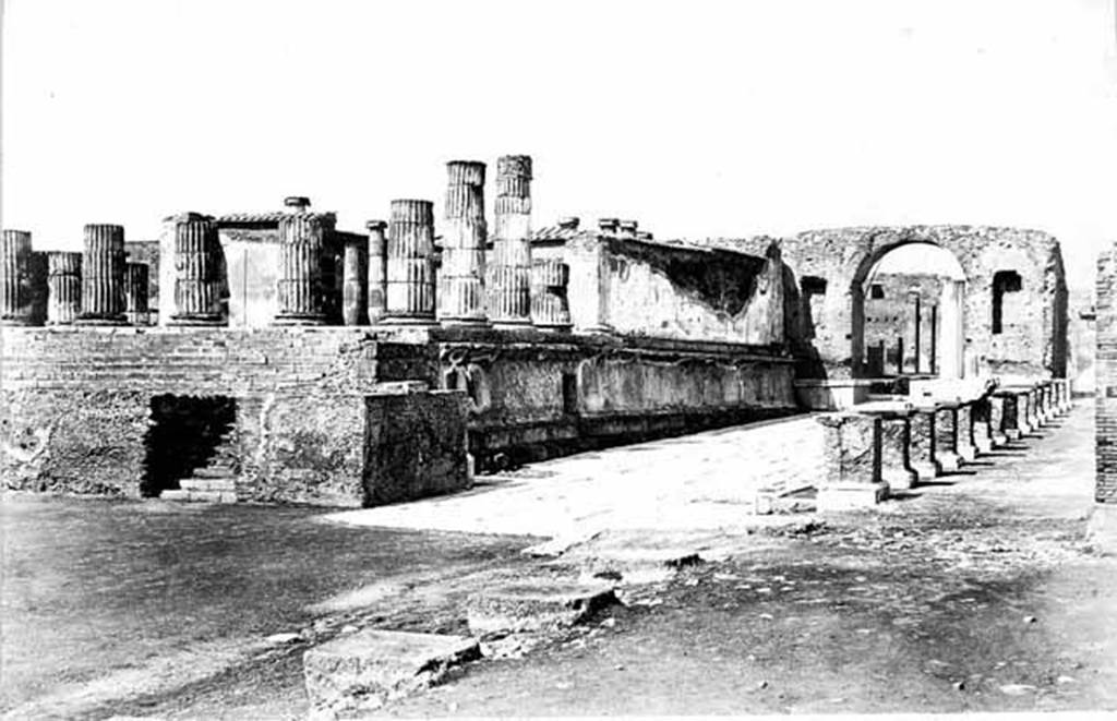 Arch at north-east end of the Forum. About 1871. 
Looking north along the east side of the Forum to the arch.