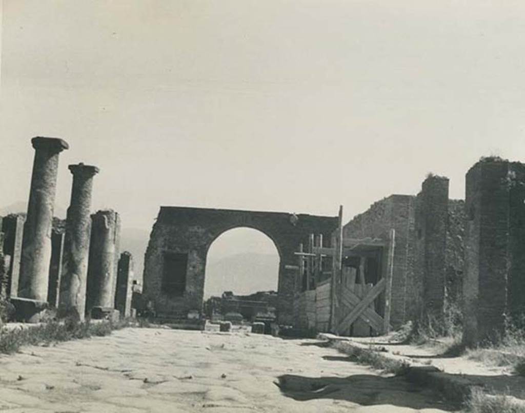 Arch at north-east end of the Forum. 1940’s. Looking south on Via del Foro towards the arch and the Forum. 
Photo courtesy of Rick Bauer.
