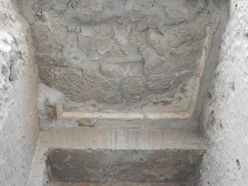 Arch at north-east end of the Forum. May 2015. Remains of fountain basin on north face of east side. 
Photo courtesy of Buzz Ferebee.