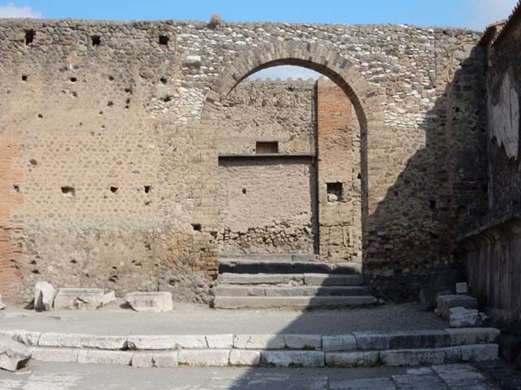 Arched entrance in north-west corner of Forum. May 2015. 
Photo courtesy of Buzz Ferebee.