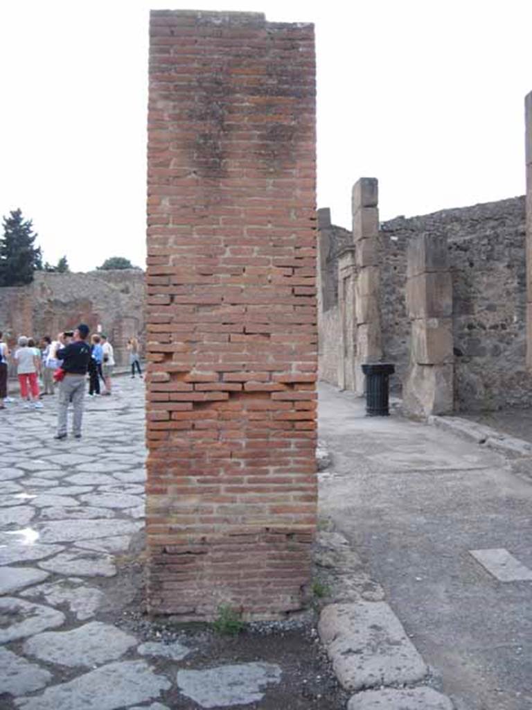Arch of Marcus Holconius Rufus. September 2010. North-west pillar looking west towards the Forum.
Photo courtesy of Drew Baker.