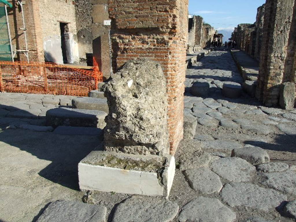 Arch of Marcus Holconius Rufus. December 2006. North-east pillar with remains of another statue base. Looking east along Via dell’Abbondanza.