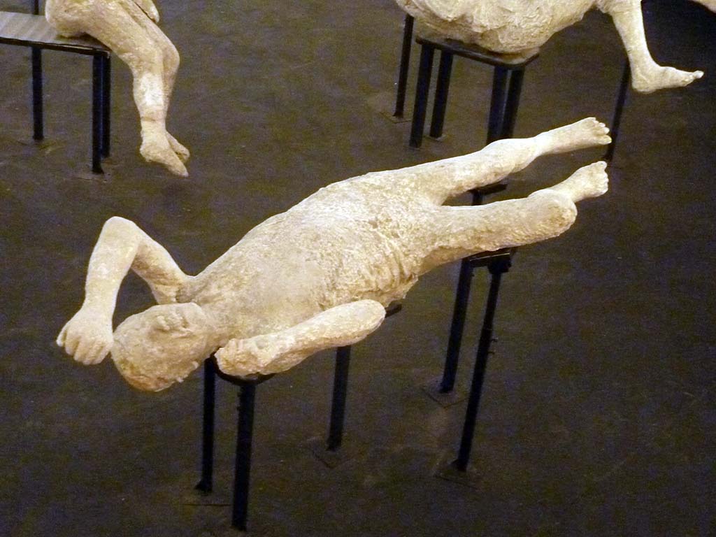 Victim 14 found on 11th October 1889 at Stabian Gate. 
Plaster cast of victim numbered 15 by Dwyer, and 14 by Garcia y Garcia, originally thought to be a woman of mature age but now identified as a male adult. 
Exhibit from the Summer 2015 exhibition in the amphitheatre.