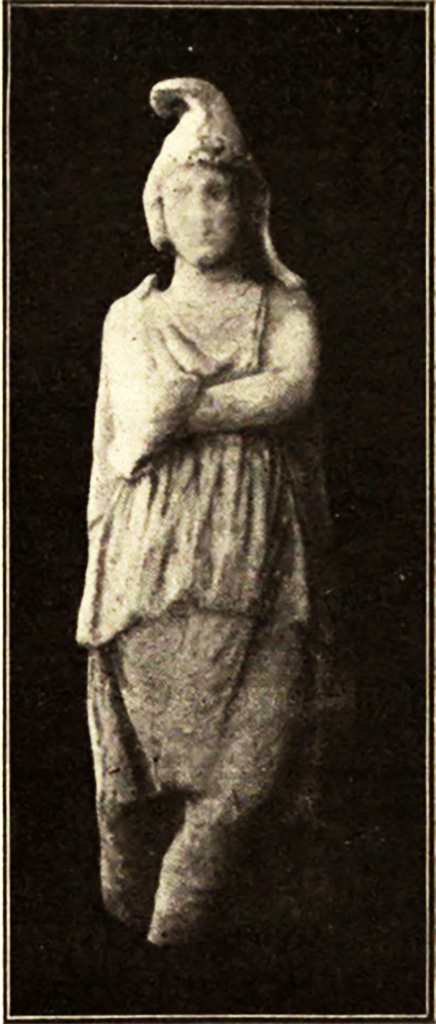 Vicolo del Menandro. May 1915. Mutilated marble statuette
Statuetta mutila, di marmo.
A few metres from the cast there is a mutilated marble statuette (0.51 m. high), of which we give a reproduction (fig. 5): it represents a male figure dressed in a knee-length chiton, a cloak and breeches, who stands upright with his legs crossed and, resting his right elbow on his left arm folded across his chest, brings his right hand to his chin. From the Phrygian cap covering his head, two ribbons descend sideways over his shoulders covered by a massive cloak with rather neglected folds.
See/Vedi Notizie degli Scavi di Antichità, 1915, p. 288-9, fig. 5.