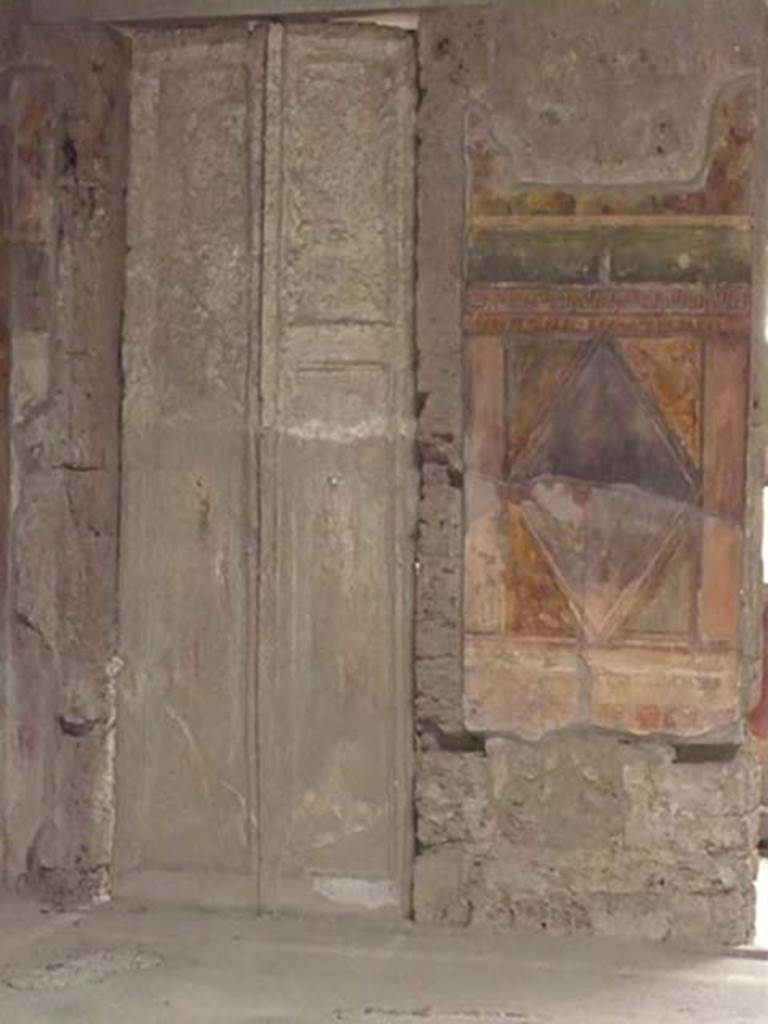Villa of Mysteries, Pompeii. May 2012. Room 64, cast of doors in north-east corner.
Photo courtesy of Buzz Ferebee.
